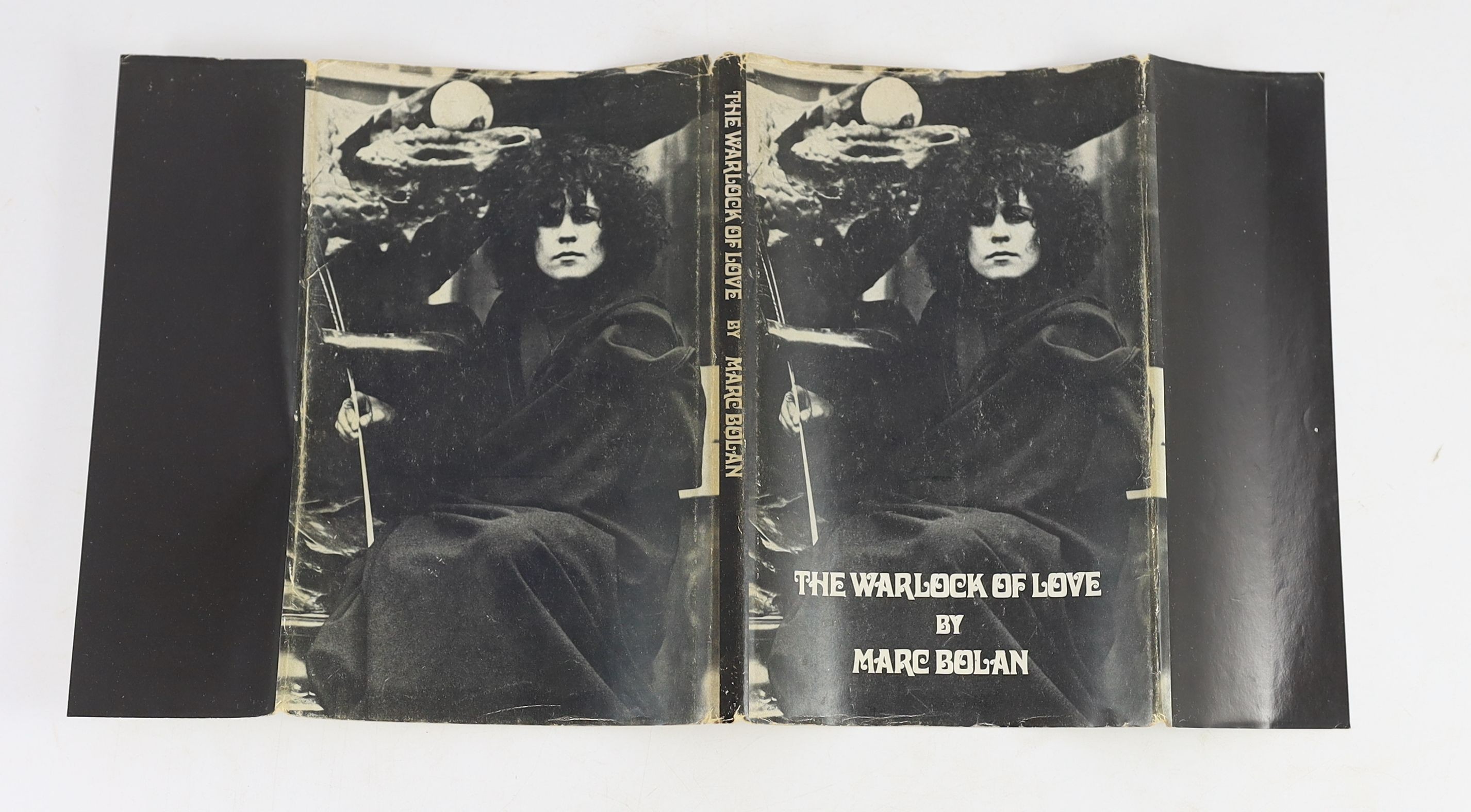 Bolan, Marc - The Warlock of Love. 1st ed. Original pictorial printed boards with unclipped d/j. 8vo. Lupus Music, Plymouth, 1969.